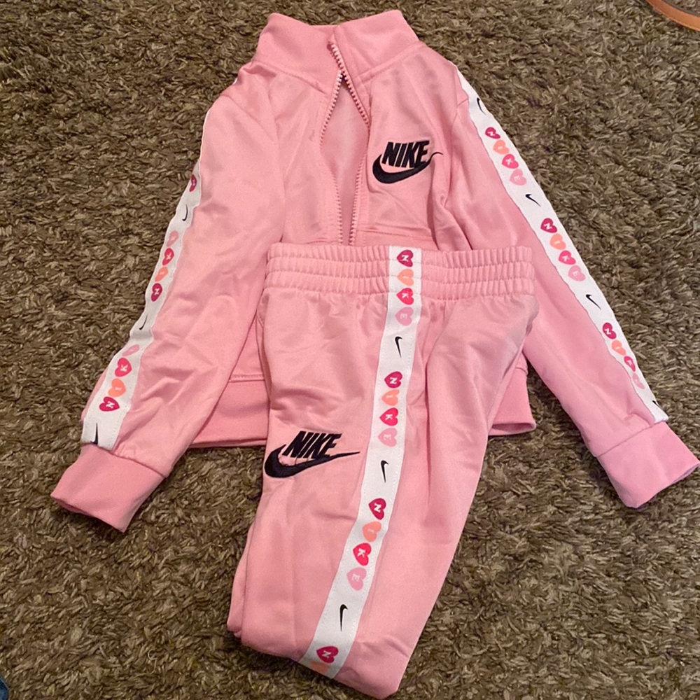 Pink Nike zip up and pant suit
